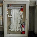Cabinet with a Fire Hose